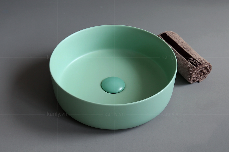 Lavabo tròn và nút nhấn xả đồng màu cuốn hút